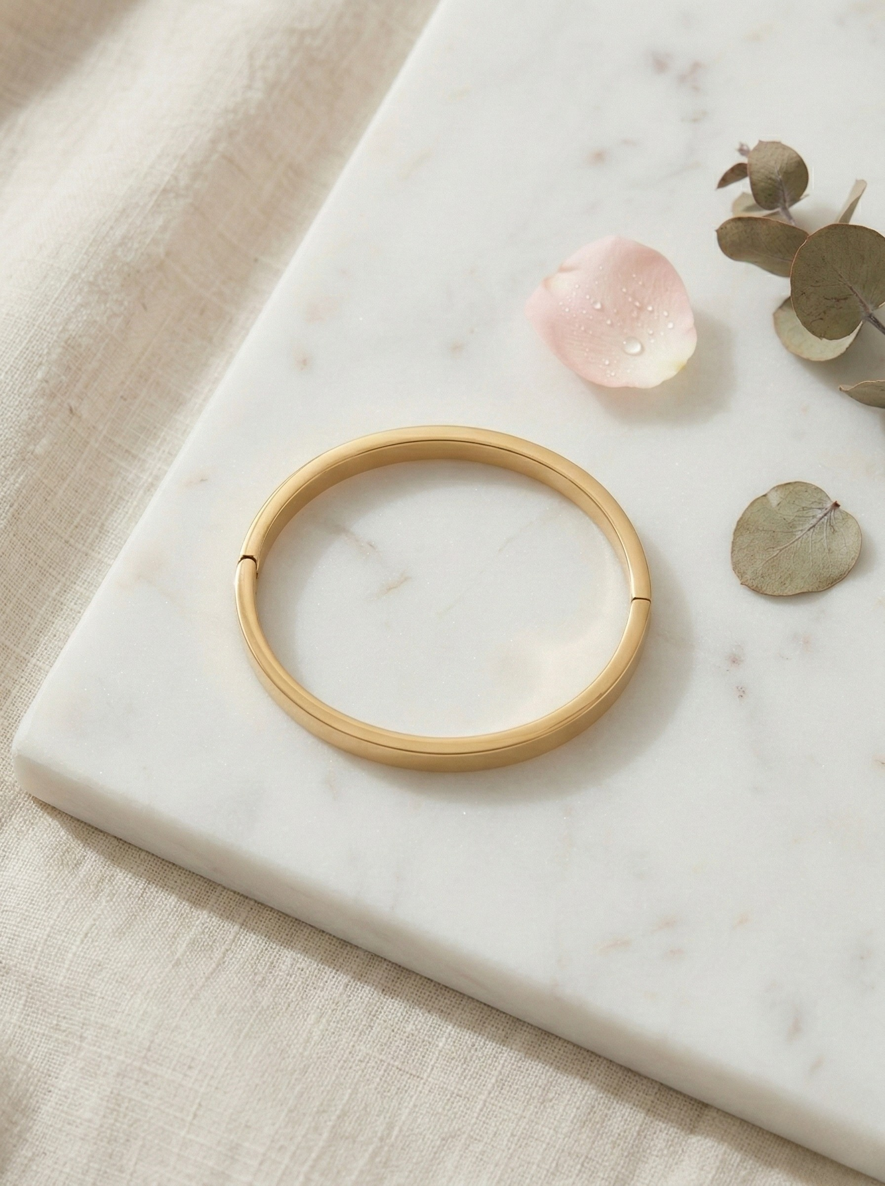 Elegant Gold Minimalist Bangle on Marble Surface