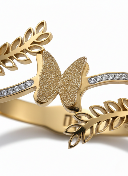 Elegant butterfly gold kada on marble flatlay.
