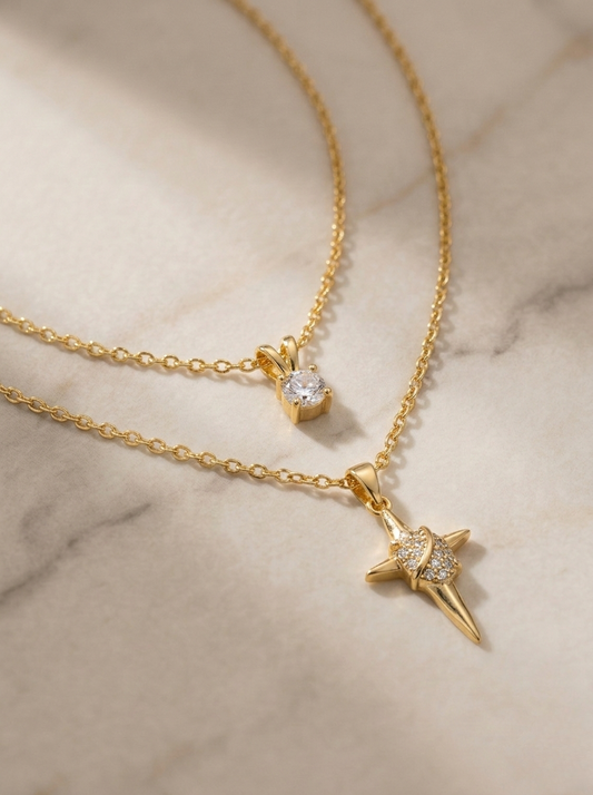 Elegant Gold Layered Necklaces on Marble Surface