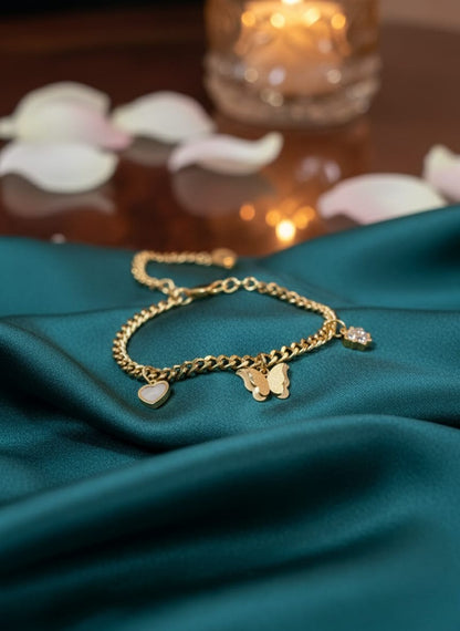 Elegant Gold Charm Bracelet with Butterfly Pendant