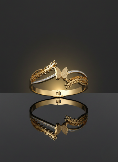 Elegant butterfly gold kada on marble flatlay.