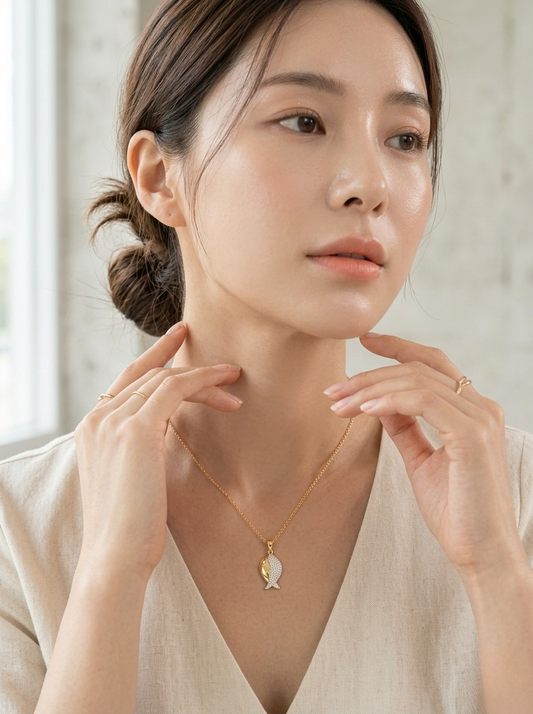 Elegant Gold Fish Pendant On Marble Surface